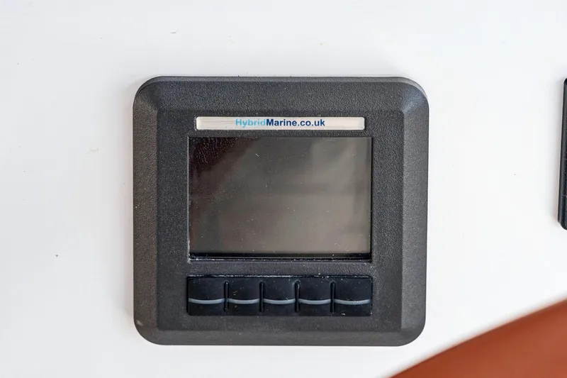 Slide: The Image of Control panel on a 2024 St Francis 460 yacht, featuring HybridMarine branding. - 143