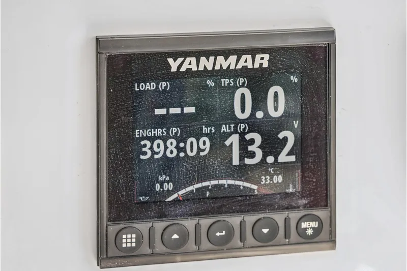 Slide: The Image of Yanmar engine display on 2024 St Francis 460, showing load, hours, and voltage. - 145