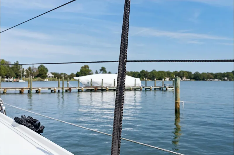 Slide: The Image of Sailboat view from St Francis 460, 2024 model, overlooking a serene marina. - 147