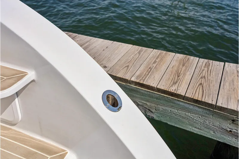 Slide: The Image of 2024 St Francis 460 yacht docked beside wooden pier, close-up view. - 149