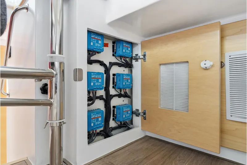 Slide: The Image of Electrical panel with blue components inside a St Francis 460, 2024 model yacht. - 154