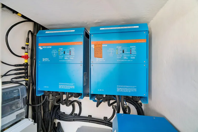 Slide: The Image of 2024 St Francis 460 electrical system with dual Victron Energy Quattro inverters. - 160