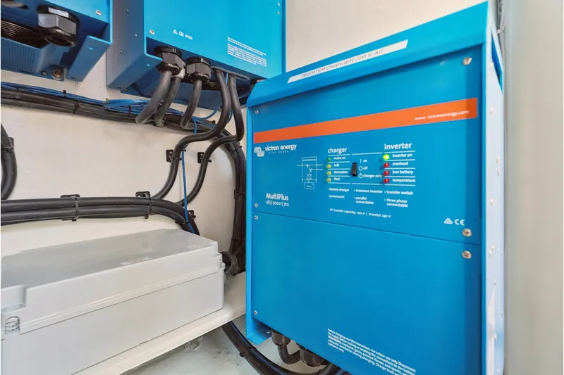 Slide: The Image of Blue Victron Energy inverter and charger system in St Francis 460, 2024 model. - 161