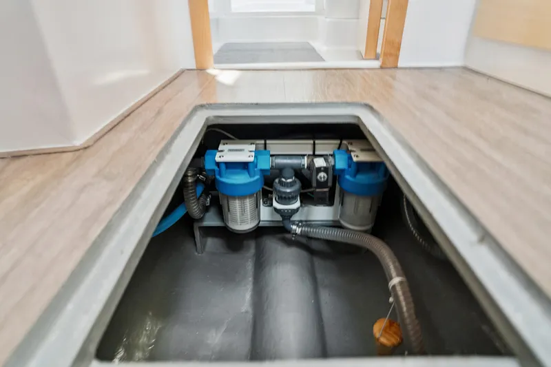 Slide: The Image of 2024 St Francis 460 yacht interior showing underfloor water filtration system. - 164