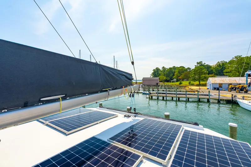 Slide: The Image of 2024 St Francis 460 yacht with solar panels docked at a marina. - 22