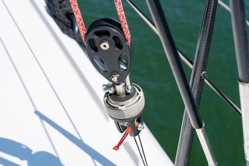 Slide: The Image of Close-up of a 2024 St Francis 460 sailboat rigging pulley system. - 28