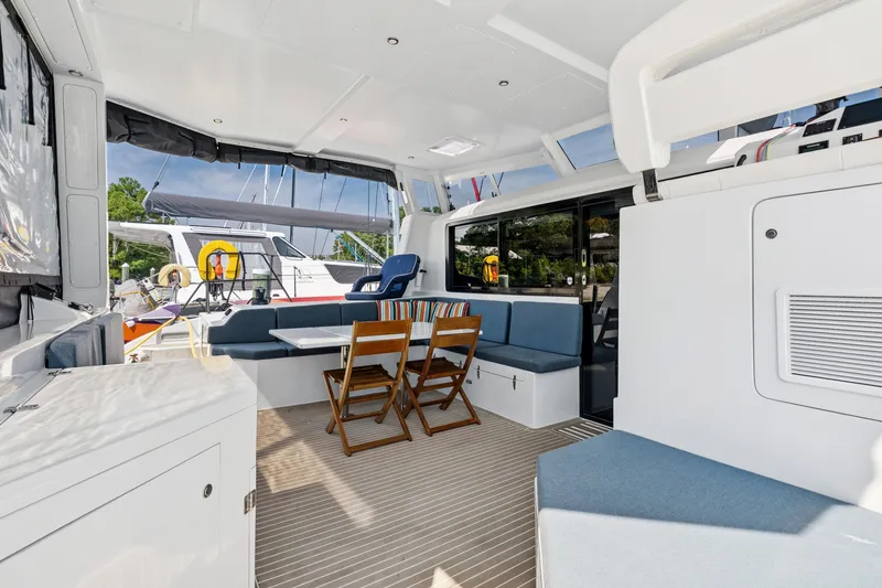 Slide: The Image of 2024 St Francis 460 yacht interior with seating, table, and modern design. - 29