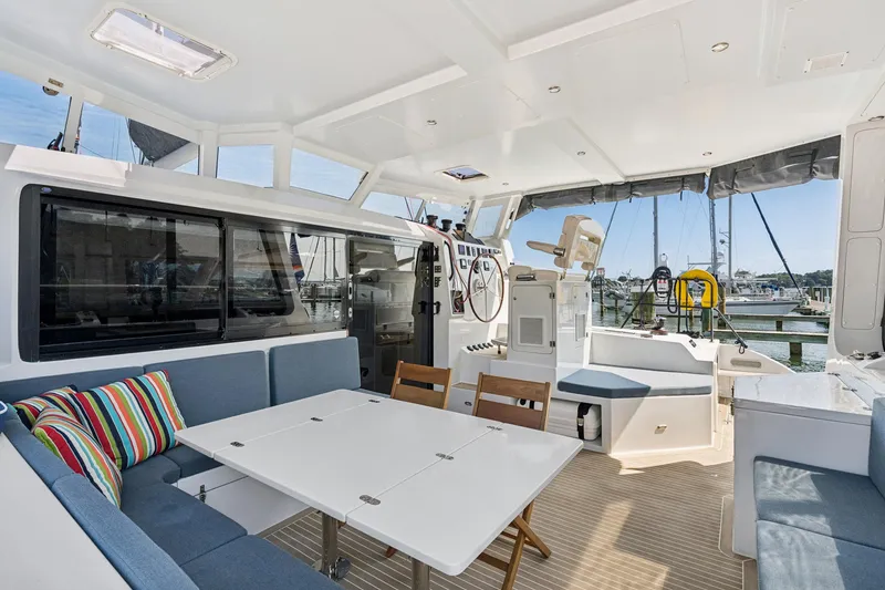 Slide: The Image of Luxurious 2024 St Francis 460 yacht interior with seating, table, and helm station. - 34