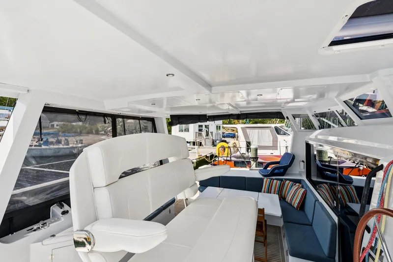 Slide: The Image of Luxurious interior of 2024 St Francis 460 yacht with modern seating and vibrant cushions. - 35
