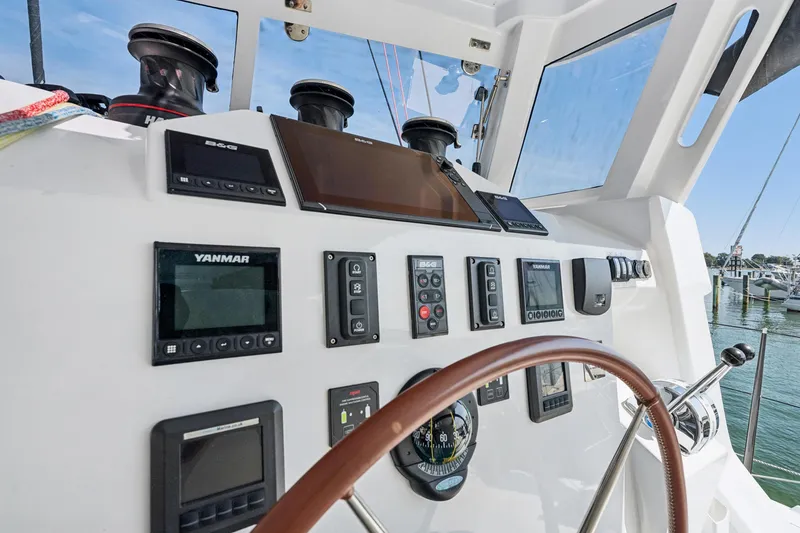 Slide: The Image of Helm of 2024 St Francis 460 yacht with navigation instruments and steering wheel. - 37