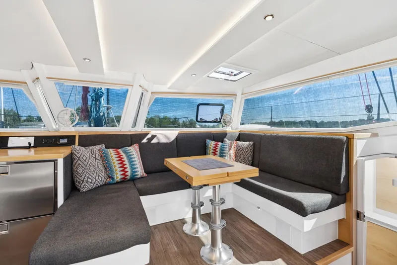 Slide: The Image of 2024 St Francis 460 yacht interior with modern seating and colorful cushions. - 40