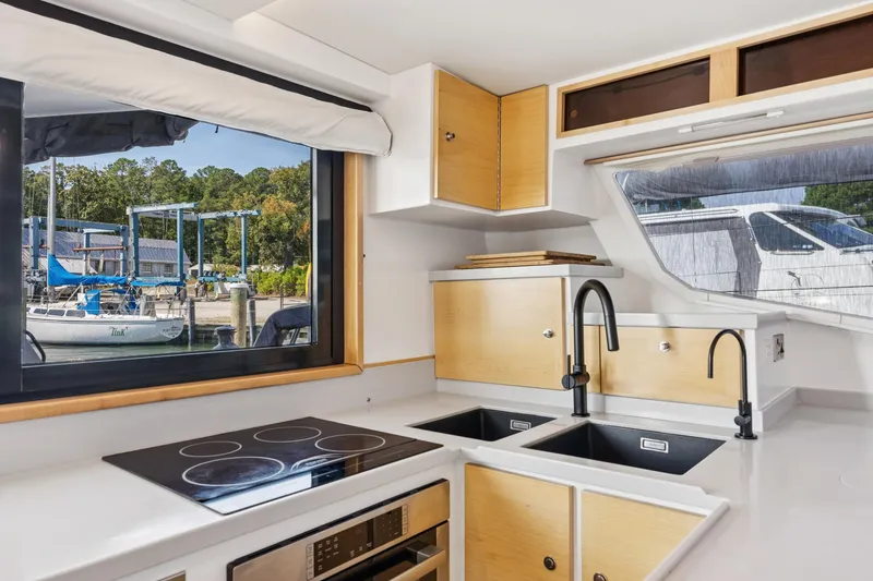 Slide: The Image of Modern kitchen interior of 2024 St Francis 460 yacht with scenic marina view. - 43