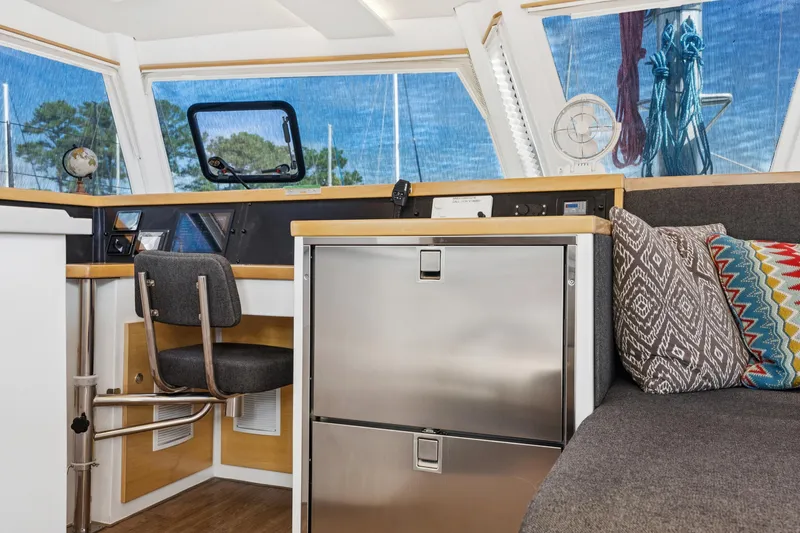 Slide: The Image of Modern interior of 2024 St Francis 460 yacht with seating, navigation area, and decorative pillows. - 51