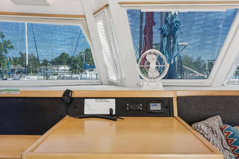 Slide: The Image of 2024 St Francis 460 yacht interior with navigation equipment and scenic window view. - 55