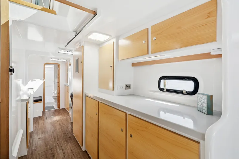 Slide: The Image of Modern interior of 2024 St Francis 460 yacht with sleek cabinetry and wood flooring. - 63