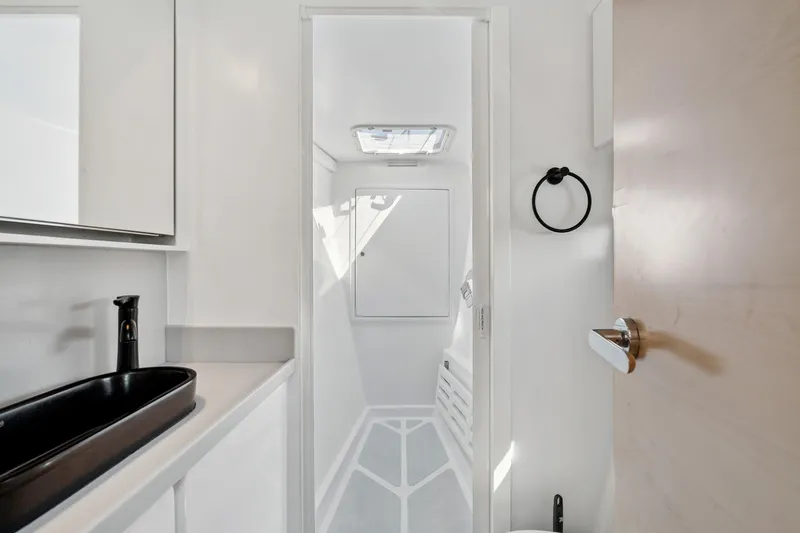 Slide: The Image of Modern bathroom interior in 2024 St Francis 460 yacht, featuring sleek black sink and minimalist design. - 67
