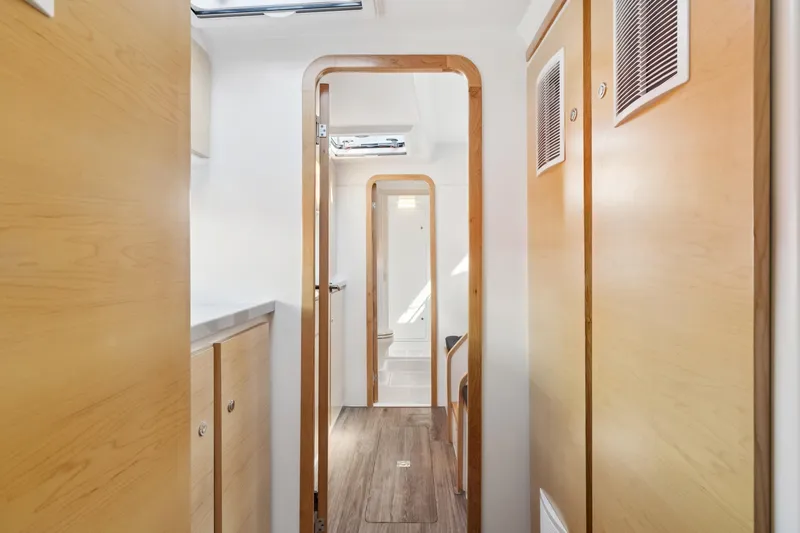 Slide: The Image of 2024 St Francis 460 interior, featuring sleek wooden cabinetry and modern design elements. - 68