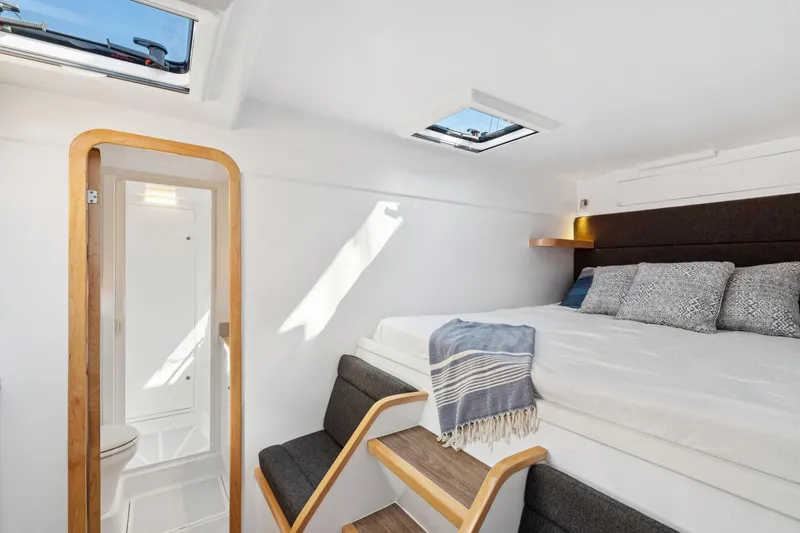 Slide: The Image of 2024 St Francis 460 yacht interior with bed, skylights, and modern design. - 71