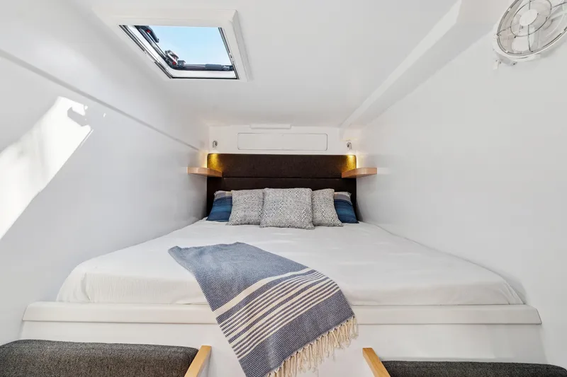 Slide: The Image of Luxurious 2024 St Francis 460 yacht cabin with skylight, cozy bed, and elegant decor. - 72