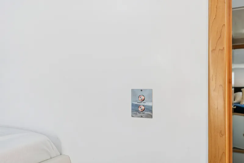 Slide: The Image of Interior of 2024 St Francis 460 yacht with light switch and wooden door frame. - 73