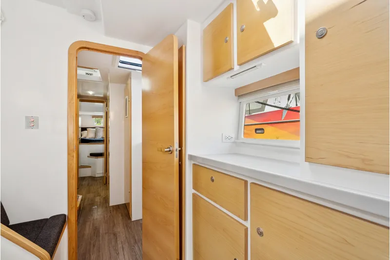 Slide: The Image of 2024 St Francis 460 interior with wooden cabinets, modern design, and natural light. - 75