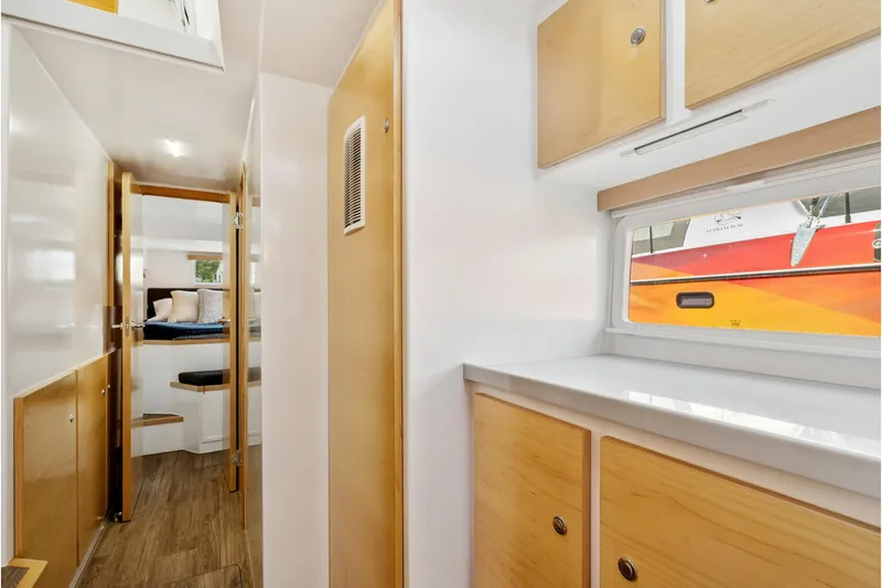 Slide: The Image of Interior of 2024 St Francis 460 yacht, featuring modern wood cabinetry and sleek design. - 76