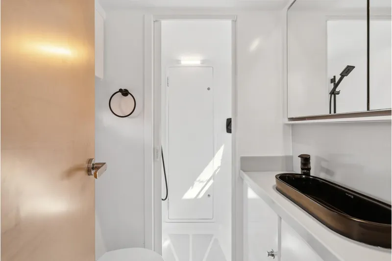 Slide: The Image of Modern bathroom in 2024 St Francis 460 yacht with sleek black sink and minimalist design. - 77