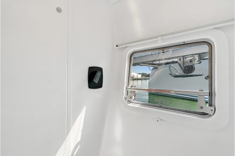 Slide: The Image of Interior view of 2024 St Francis 460 boat window with exterior water scene. - 83