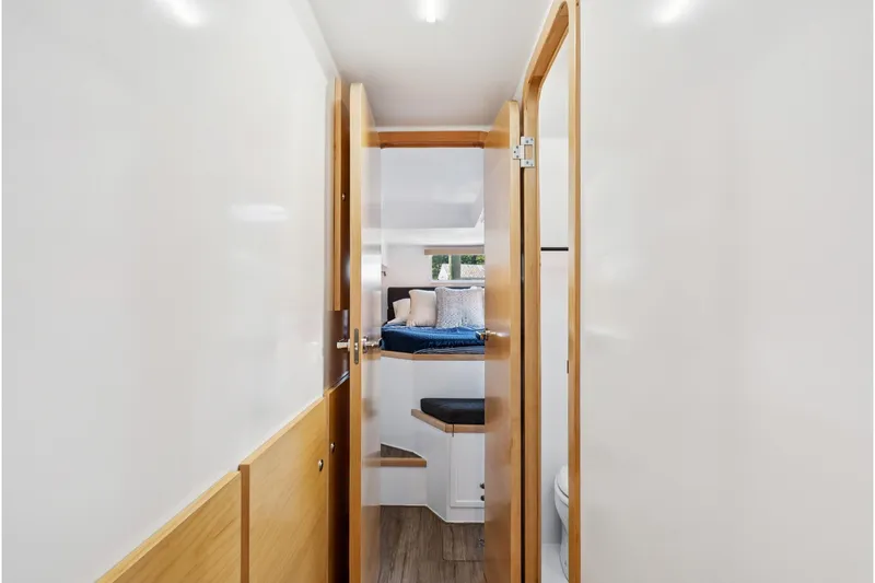 Slide: The Image of Interior view of 2024 St Francis 460 yacht cabin with cozy bedding and modern design. - 84
