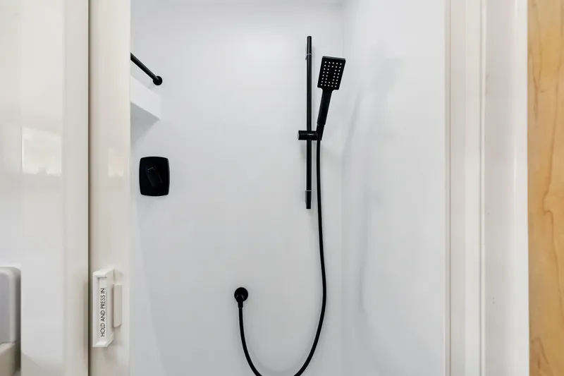 Slide: The Image of Modern shower with black fixtures in 2024 St Francis 460 model bathroom. - 88