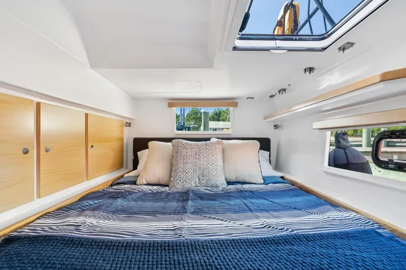 Slide: The Image of Luxurious cabin interior of 2024 St Francis 460 yacht with cozy bedding and natural light. - 91