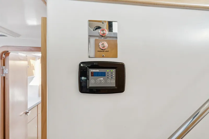 Slide: The Image of Control panel and light switches inside 2024 St Francis 460 yacht interior. - 94