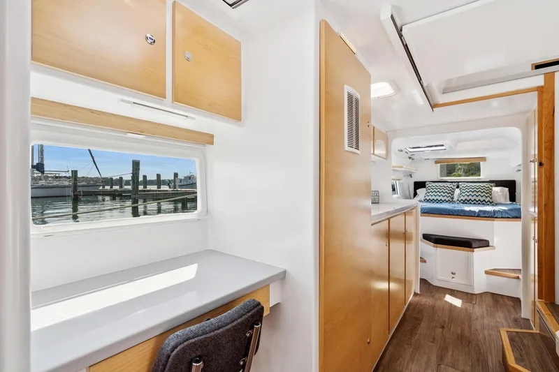 Slide: The Image of Modern interior of 2024 St Francis 460 yacht with wood accents and waterfront view. - 96
