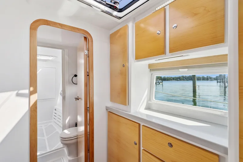 Slide: The Image of Modern bathroom interior on 2024 St Francis 460 yacht with wooden cabinets and scenic window view. - 98