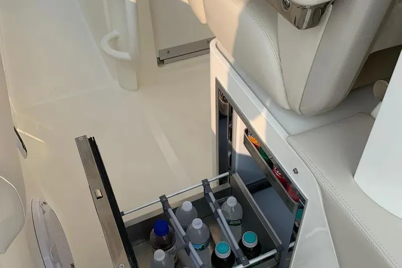 Slide: The Image of Built-in cooler drawer on 2019 Boston Whaler 380 Outrage, stocked with beverages. - 23