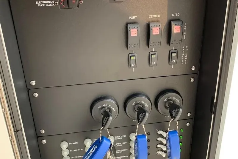 Slide: The Image of Control panel of a 2019 Boston Whaler 380 Outrage boat with switches and keys. - 30