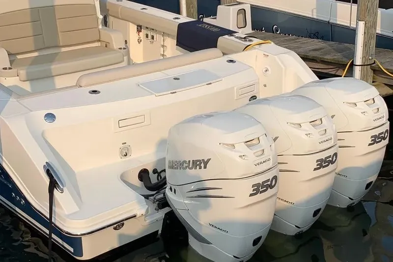 Slide: The Image of 2019 Boston Whaler 380 Outrage with triple Mercury 350 Verado engines docked. - 31