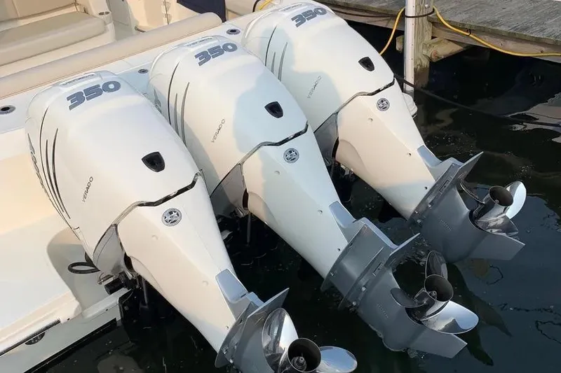 Slide: The Image of Triple 350 horsepower engines on a 2019 Boston Whaler 380 Outrage boat. - 32