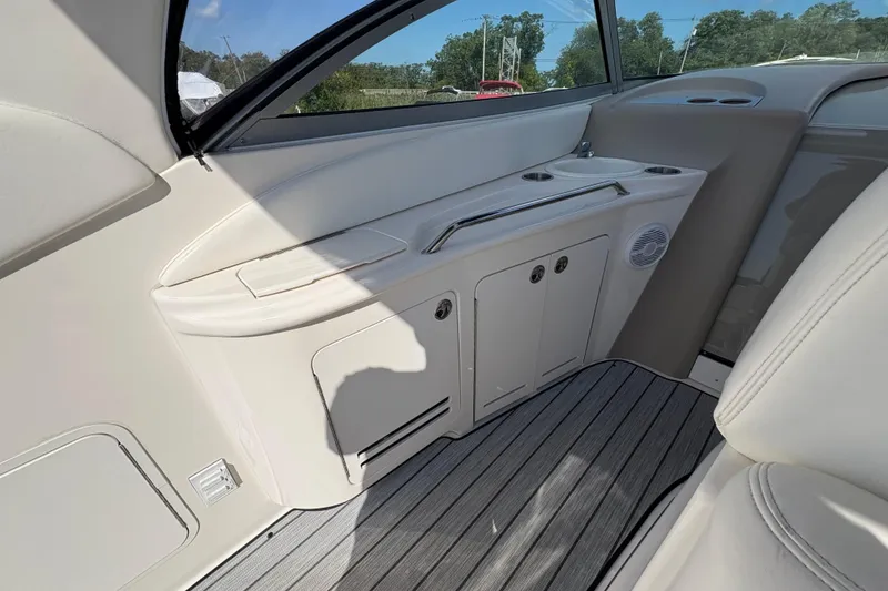 Slide: The Image of 2002 Sea Ray 340 Sundancer interior with sleek cabinetry and modern design elements. - 14