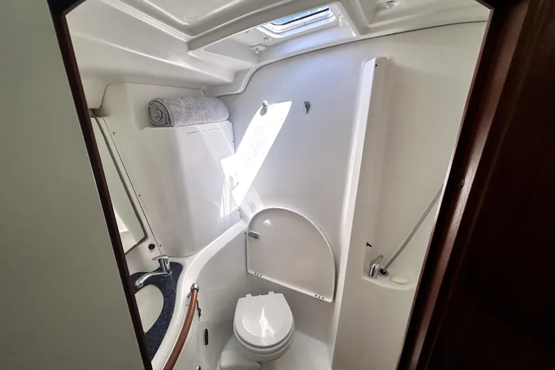 Slide: The Image of Bathroom interior of 2003 Beneteau Oceanis Clipper 473 yacht, featuring toilet and sink. - 19