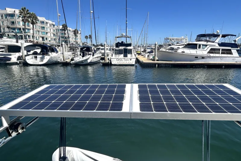 Slide: The Image of Solar panels on a 2003 Beneteau Oceanis Clipper 473 in a marina setting. - 26