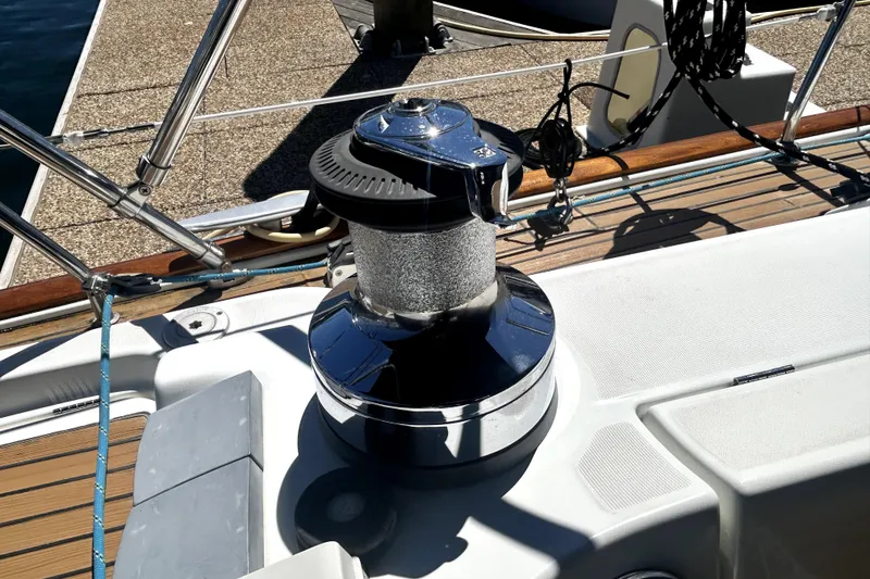Slide: The Image of Winch on 2003 Beneteau Oceanis Clipper 473 sailboat deck, docked at marina. - 9