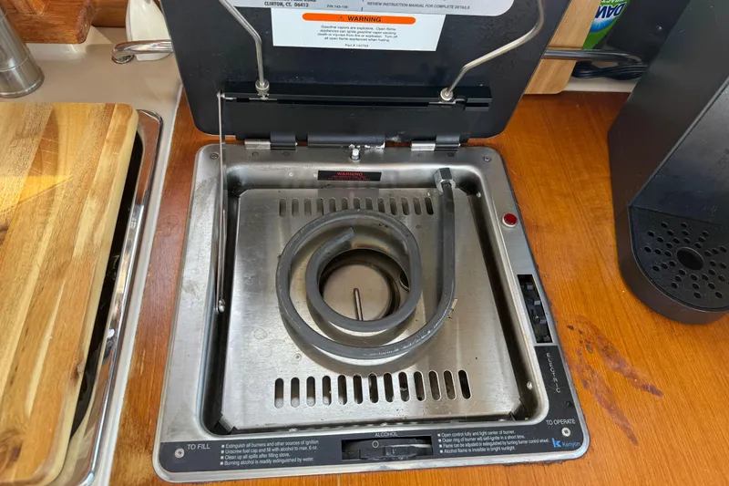Slide: The Image of Electric stove on 2017 Ranger Tugs R-23 boat, featuring a single coil burner. - 15