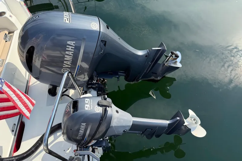 Slide: The Image of Yamaha outboard motors on 2017 Ranger Tugs R-23, with American flag in view. - 29