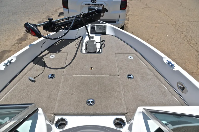 Slide: The Image of 2012 Triton 190 boat deck with trolling motor and control panel. - 25