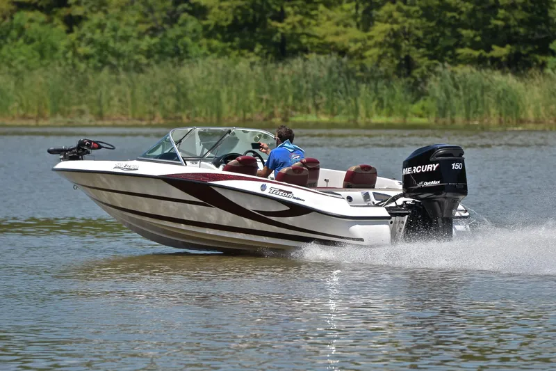 Slide: The Image of 2012 Triton 190 boat speeding on a lake with Mercury 150 engine. - 4