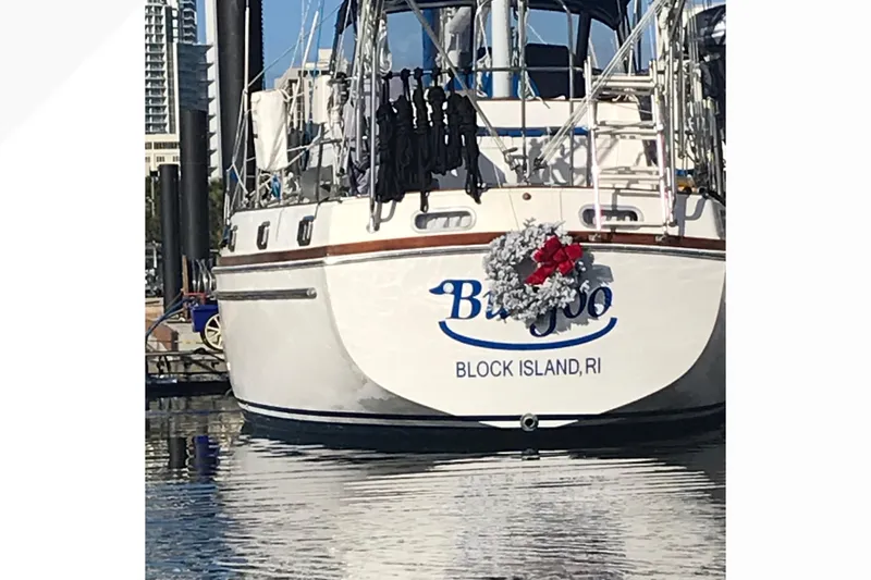 The Image of 1980 Gulfstar 47 Sailmaster yacht sailing on open sea with American flag. - 0
