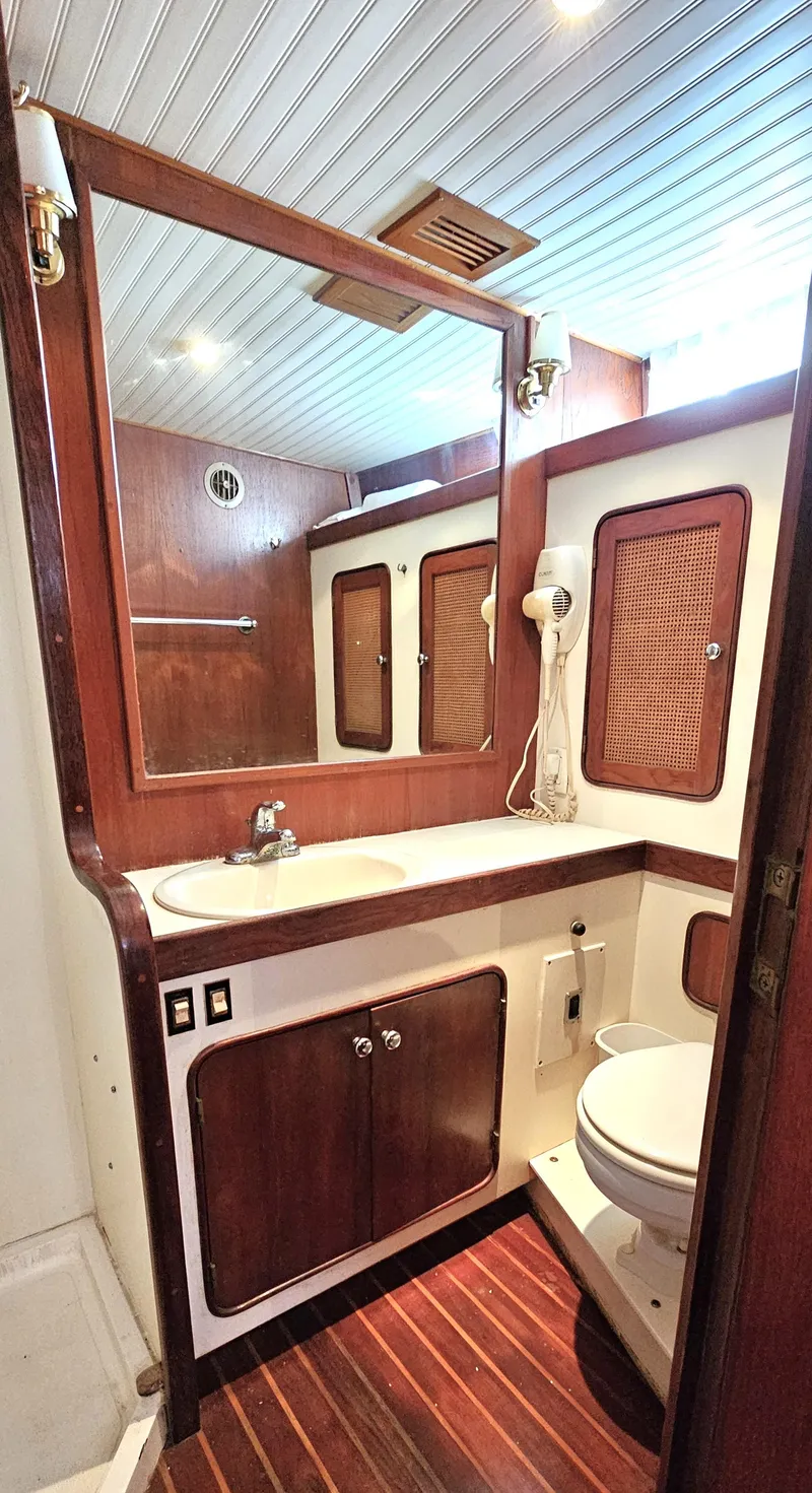 Slide: The Image of Interior view of 1980 Gulfstar 47 Sailmaster, showcasing wooden craftsmanship. - 13