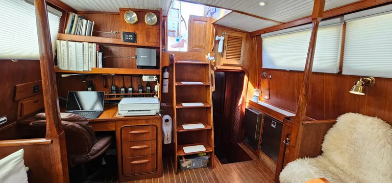 Slide: The Image of Interior of 1980 Gulfstar 47 Sailmaster, featuring bathroom and kitchen with wood accents. - 8