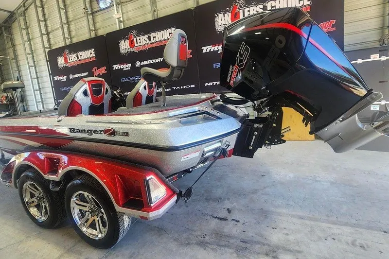 Slide: The Image of 2026 Ranger Z520R Cup-Equipped boat with powerful engine, showcased indoors. - 4